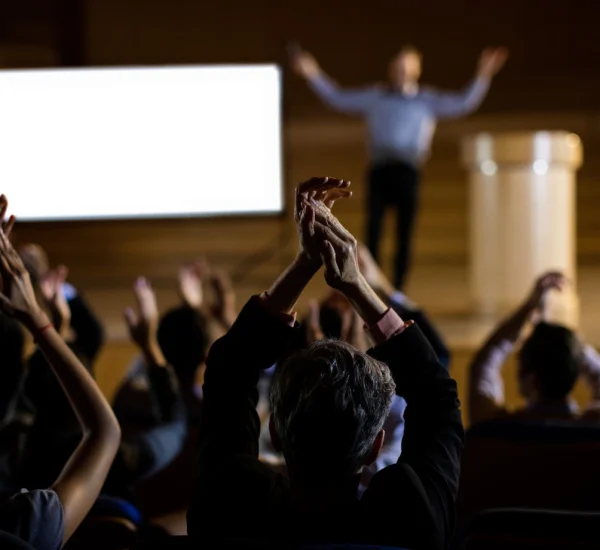 audience-applauding-speaker-after-conference-presentation_107420-63802